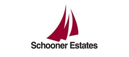 Schooner Estates logo featuring red sailboat silhouettes.
